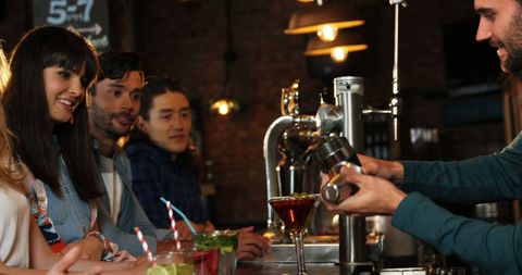 Young Friends Enjoying Drinks at Trendy Bar with Bartender - Download Free Stock Images Pikwizard.com