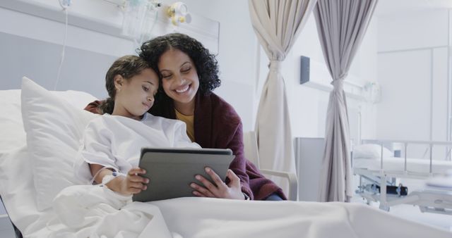 Mother and Daughter Using Tablet in Hospital Room - Download Free Stock Images Pikwizard.com