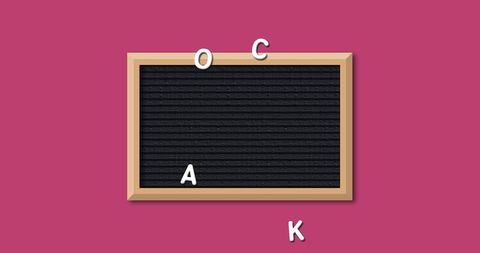 Letter Board with Scattered Letters on Pink Background