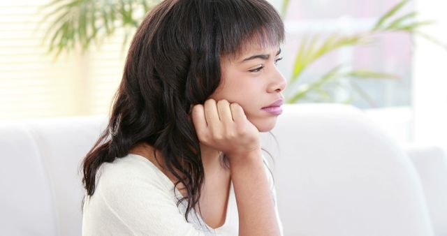 Pensive Young Woman Reflecting Indoors - Download Free Stock Images Pikwizard.com