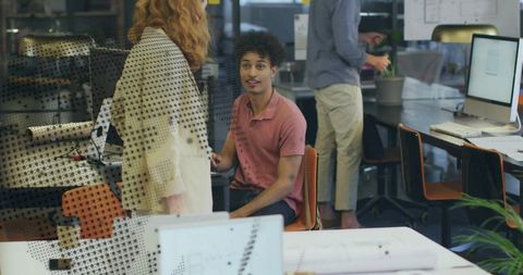 Young professionals experiencing modern office interactions