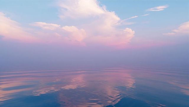 Tranquil Ocean Reflection with Pastel Sky at Sunrise