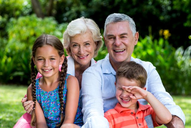 Happy Grandparents with Grandchildren in Garden - Download Free Stock Photos Pikwizard.com
