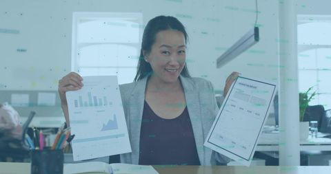 Businesswoman Analyzing Data with Financial Documents