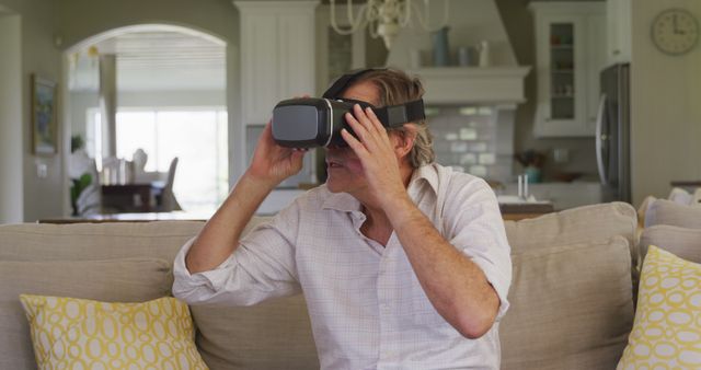Senior Man Using Virtual Reality Headset in Home Living Room - Download Free Stock Images Pikwizard.com