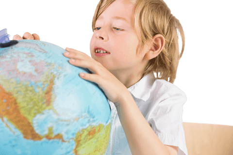 Curious schoolboy gazing at globe on transparent background