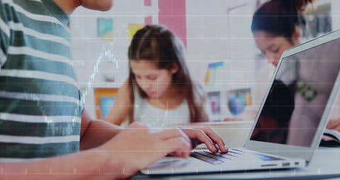 Students Learning Financial Concepts on Laptops in Classroom