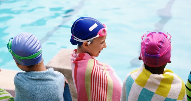 Young Swimmers Relaxing Poolside with Colorful Towels - Download Free Stock Images Pikwizard.com