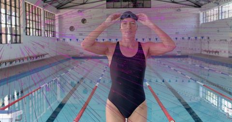 Competitive Swimmer Securing Goggles on Pool Deck Before Race