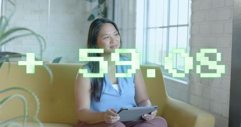 Businesswoman Analyzing Financial Growth Data on Tablet