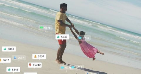 Father swinging daughter on sunlit beach with social media notification overlays