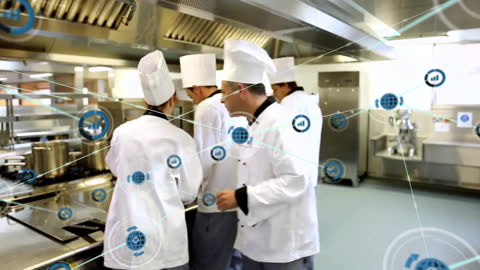 Chefs Collaborating with Network Connections in Modern Kitchen