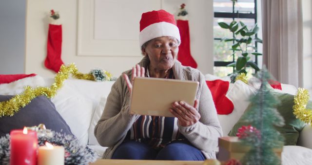 Senior Woman Video Calling Family during Christmas Celebration at Home - Download Free Stock Images Pikwizard.com