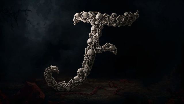 Gothic skull and bones j-shaped sculpture in dimly lit cavern