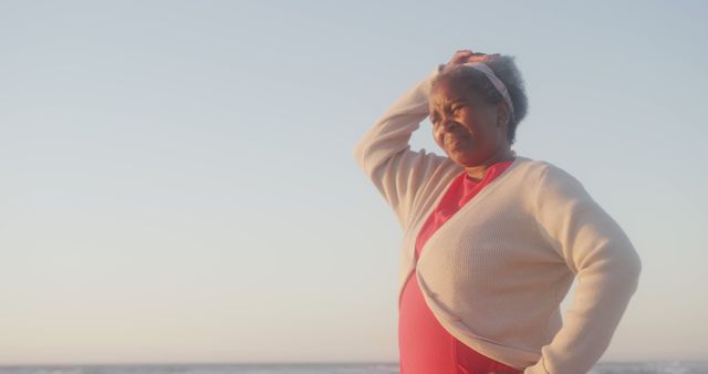 Senior Woman Looking Pensive at Beach During Sunset - Download Free Stock Images Pikwizard.com