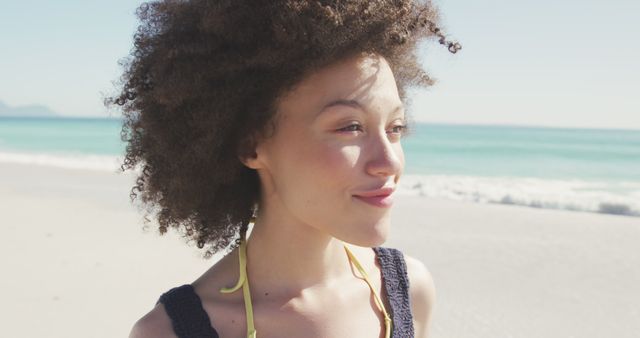 Portrait of smiling biracial woman with curly, brown hair. Summer, free time, chill, vacation, happy time.
