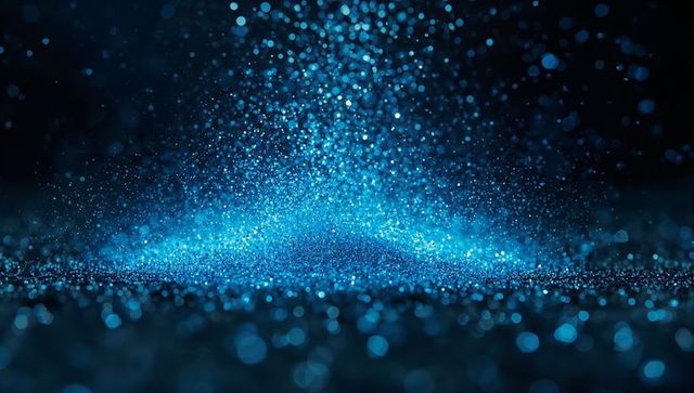 Glowing blue particles on reflective surface, abstract futuristic glow