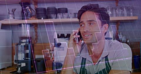 Barista talking on phone while monitoring coffee shop sales growth and digital analytics