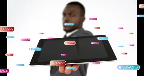 Businessman presenting tablet with floating ui tags and notifications for marketing demo