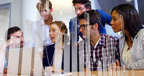 Diverse Team Collaborating with Financial Data Technology in Office