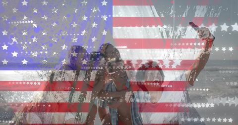 Group of friends taking selfie on beach with american flag overlay for fourth of july