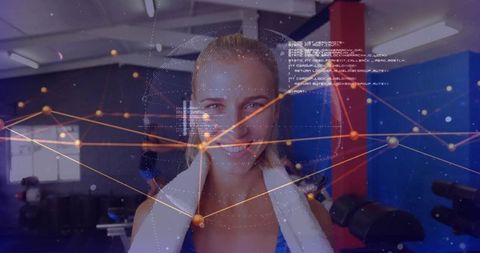 Smiling blonde woman wearing towel at gym with digital network overlay for fitness tech