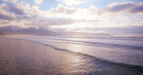 tranquil seascape transparent waters and sunset clouds - Download Free Stock Videos Pikwizard.com