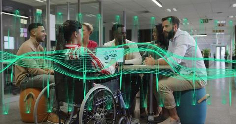 Inclusive team collaborating around round table with wheelchair and digital ar waveform overlay