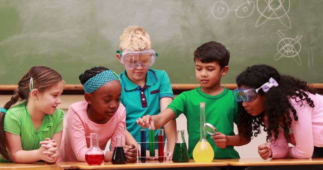 Children in classroom conducting science experiment with various colored liquids in test tubes and beakers. They wear safety goggles and interact enthusiastically. Perfect for educational materials, school brochures, science-related advertisements, and teamwork illustrations.