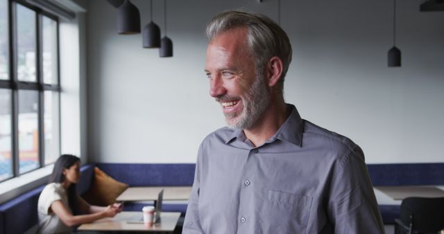 Confident Senior Businessman Smiling in Modern Office Environment - Download Free Stock Images Pikwizard.com