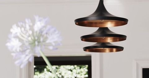 Contemporary pendant light fixture in minimalist interior setting