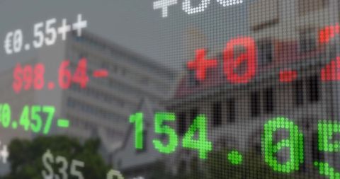 Stock market ticker overlaying urban skyline with corporate edifice