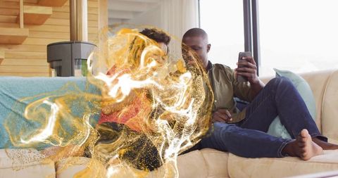 Couple Relaxing on Sofa with Unique Golden Light Effect