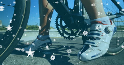 Close-Up of Cyclist with Digital Snowflakes Animation