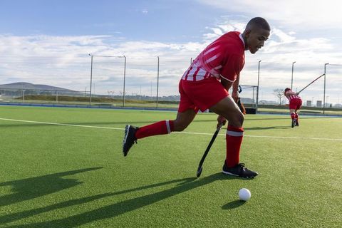 Field hockey player in action during competitive match