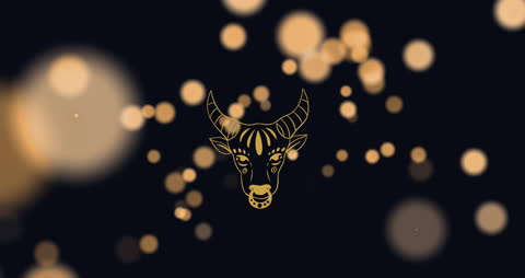 Zodiac Taurus Symbol with Golden Bokeh Background