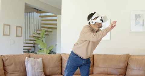 Man Exploring Virtual Reality in Modern Living Room