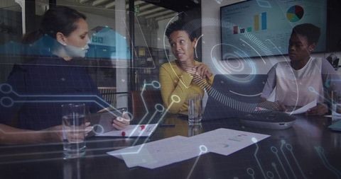 Innovative businesswomen analyzing data with holographic technology