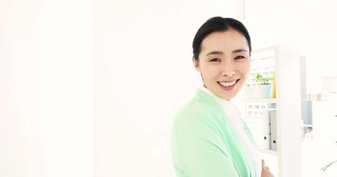 Smiling Asian Businesswoman in Bright Office Environment - Download Free Stock Images Pikwizard.com