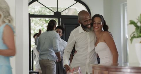 Joyful Friends Reuniting for Celebratory Occasion at Bright Home