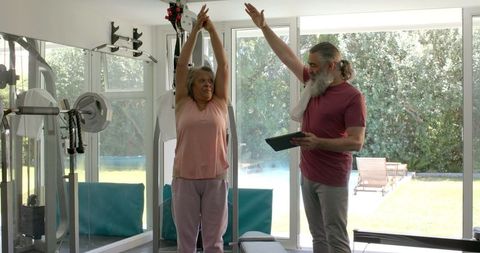 Senior Couple Exercising in Home Gym for Active Lifestyle