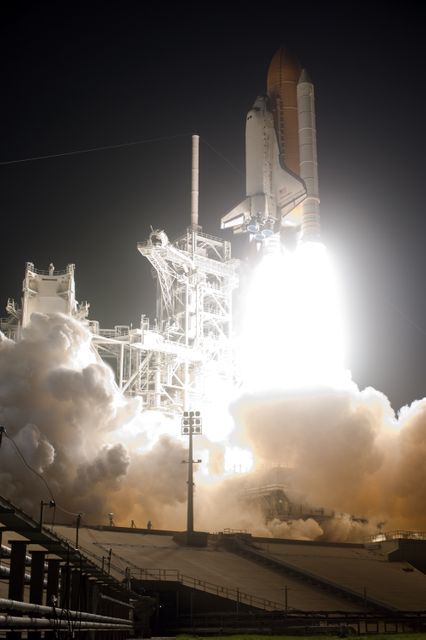CAPE CANAVERAL, Fla. –Billows of smoke and steam flow across  Launch Pad 39A at NASA's Kennedy Space Center in Florida as space shuttle Discovery lifts off on the STS-128 mission. Liftoff was on time at 11:59 p.m. EDT. The first launch attempt on Aug. 24 was postponed due to unfavorable weather conditions.  The second attempt on Aug. 25 also was postponed due to an issue with a valve in space shuttle Discovery's main propulsion system.  The STS-128 mission is the 30th International Space Station assembly flight and the 128th space shuttle flight. The 13-day mission will deliver more than 7 tons of supplies, science racks and equipment, as well as additional environmental hardware to sustain six crew members on the International Space Station. The equipment includes a freezer to store research samples, a new sleeping compartment and the COLBERT treadmill.  Photo credit: NASA/Tony Gray-Tom Farrar