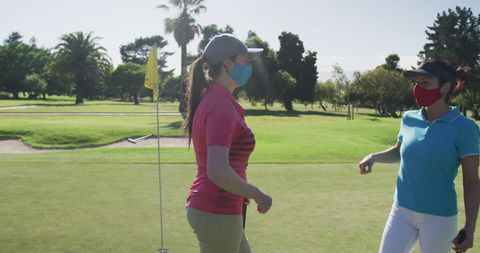 Women Golfers Greeting with Elbows During Pandemic