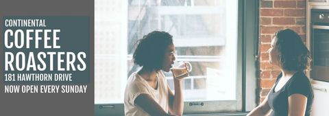 Two Women Enjoying Coffee at Local Café Promoting Community
