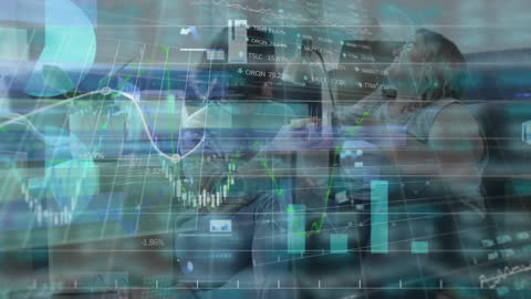 Two Women Movers Analyzing Financial Data in Modern Setting