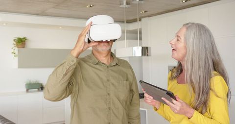 Senior Couple Experiencing Virtual Reality Technology Comfortably at Home