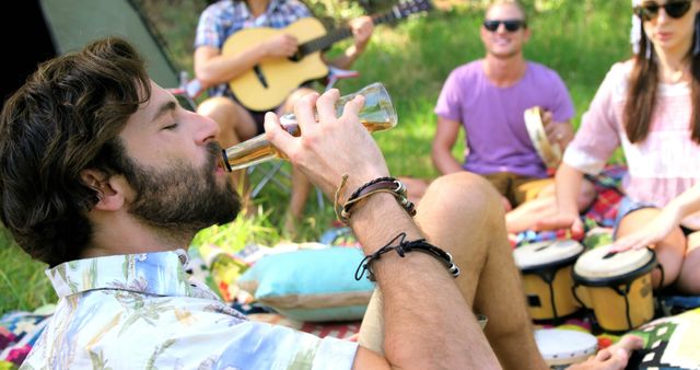 Young Adults Enjoying Outdoor Picnic with Live Music - Download Free Stock Images Pikwizard.com