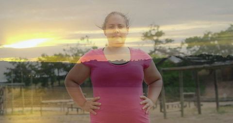 Woman Exercising at Fitness Park During Sunset