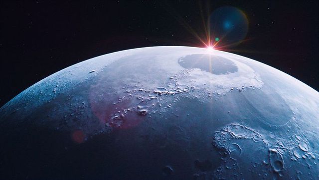 Cratered lunar surface with rising star lens flare