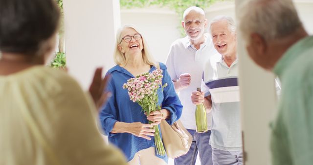 Senior Friends Visiting with Flowers and Wine - Download Free Stock Images Pikwizard.com